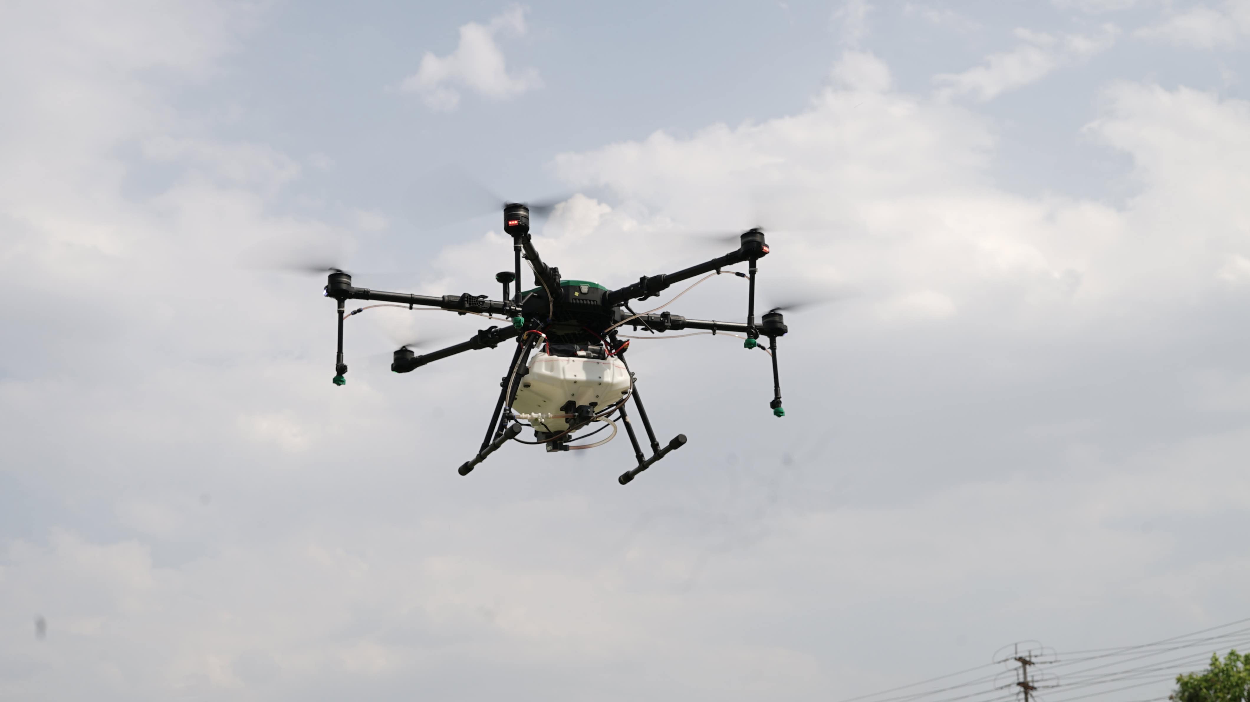 Shakti hexacopter flying against a cloudy sky